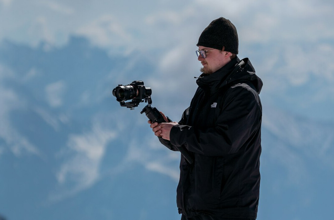 Trainer teaching video journalists during a practical field workshop