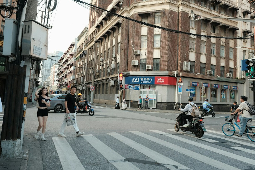 Video journalism crew filming an urgent news report on a city street