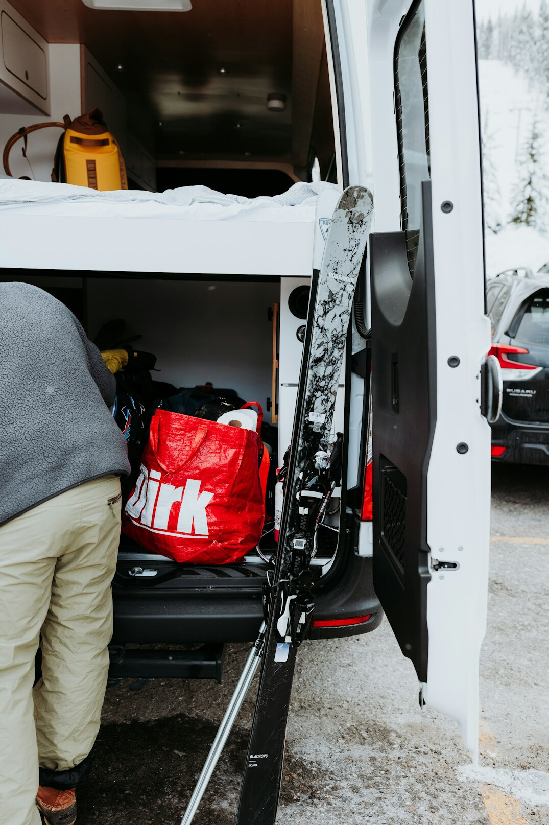 News team loading equipment into a van for rapid deployment